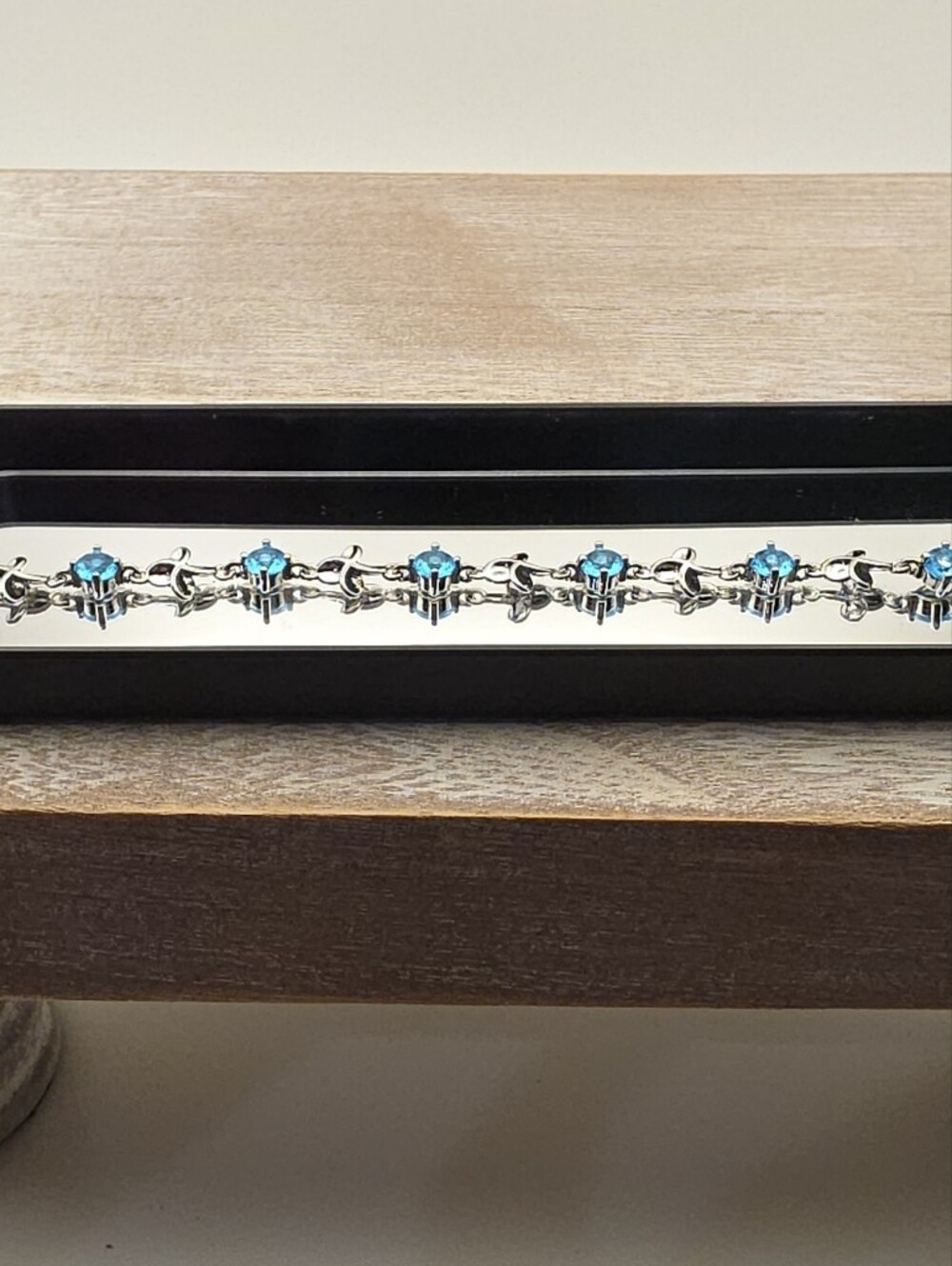 Black Jewelry Tray with Blue Gem Bracelet Display